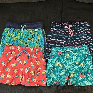 4 pairs of swim trunks